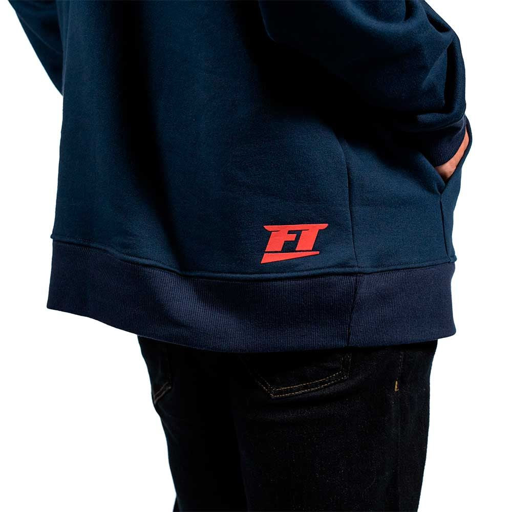 Back view of FuelTech Navy Blue Hoodie showing red FT logo on lower hip.